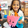 kid holding custom made pink unicorn